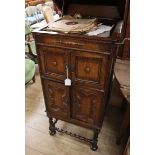 A 1920's oak cabinet, wind-up gramophone and 78 rpm records gramophone W.58cm