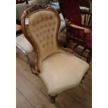 A Victorian walnut spoon back nursing chair