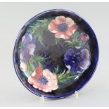 A Moorcroft 'anemone' cobalt blue ground bowl, c.1950, impressed mark Moorcroft Made in England,