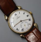 A gentleman's early 1940's Omega 14k manual wind wrist watch, on later associated leather strap.