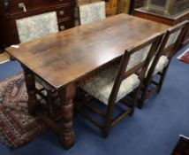 An 18th century style oak refectory dining table and four tapestry upholstered chairs W.168cm