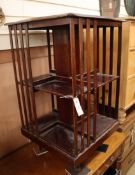 An Edwardian inlaid mahogany revolving bookcase W.48cm