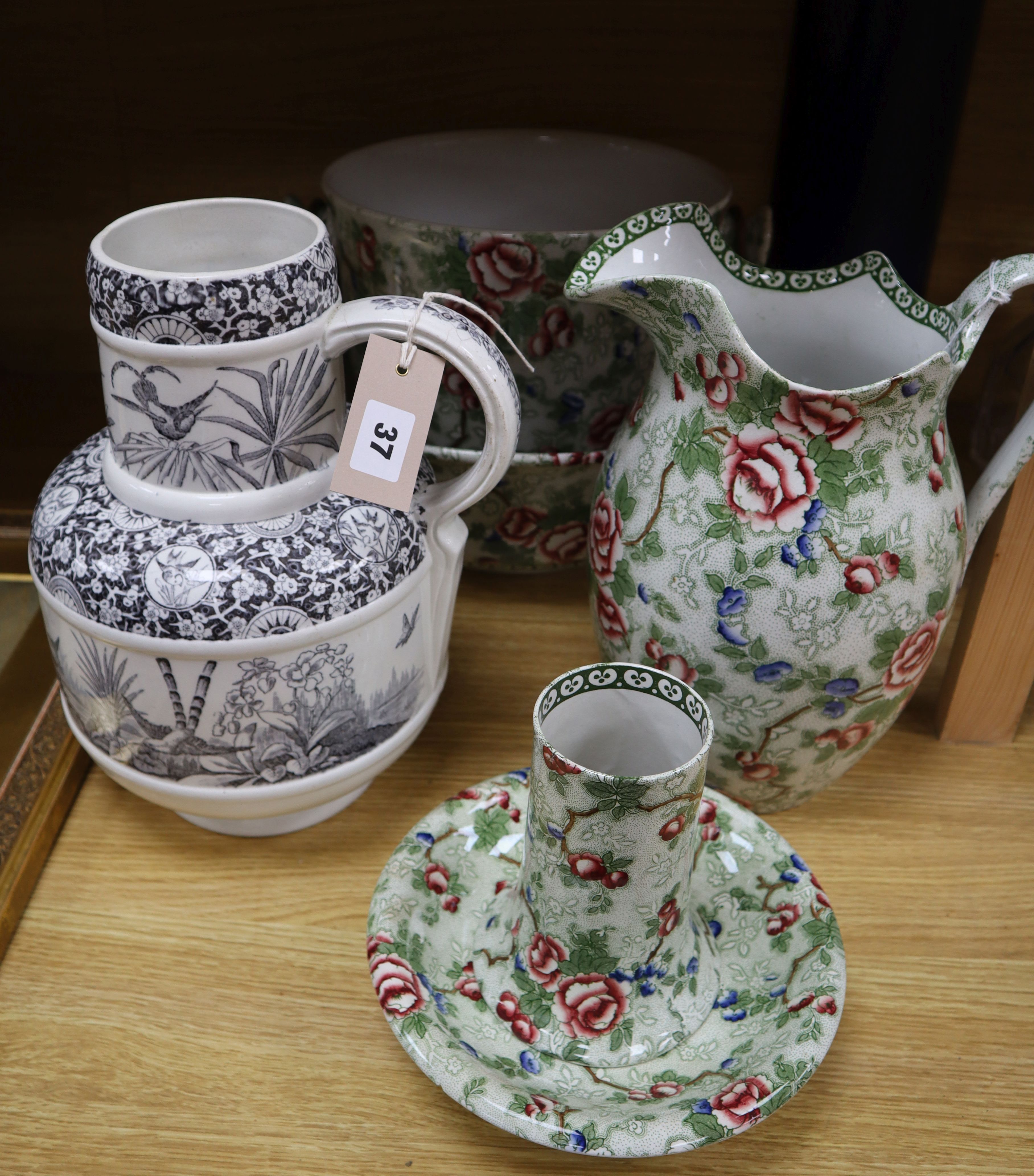 An Albion pottery `Chinese Rose' pattern part toilet set (5 pieces) and an aesthetic taste