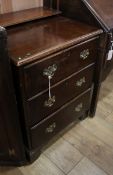 A Georgian style walnut three drawer chest W.60cm