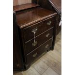 A Georgian style walnut three drawer chest W.60cm