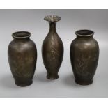 A pair of Chinese silver wire inlaid bronze vases and a Japanese bronze vase, c. 1900 tallest 26cm