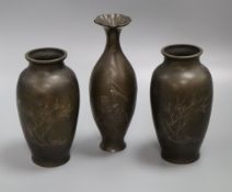 A pair of Chinese silver wire inlaid bronze vases and a Japanese bronze vase, c. 1900 tallest 26cm