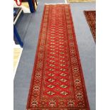 A Turkman carpet 292 x 79cm