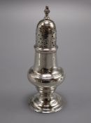 A George III silver pepperette/caster by Thomas Shepherd, London 1776, 12.9cm.