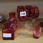 A collection of cranberry glassware