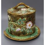 A George Jones majolica 'wild rose' pattern cheese dome on stand height 26cm