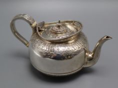 A late Victorian silver squat shaped teapot by Martin, Hall & Co, London, 1891, gross 11.5 oz.