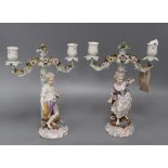 A pair of Continental porcelain figural candlesticks height 28cm