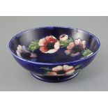 A Moorcroft 'anemone' footed bowl, 1930/40's, with a cobalt blue ground, impressed mark W. Moorcroft