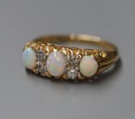 An 18ct and 'plat', white opal and diamond set half hoop ring, size K.