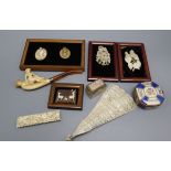 Two framed lava cameos, ivory brooches, ivory brise fan, meerschaum pipe etc.