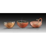 Three bowls. Early Bronze Age, Eastern Mediterranean, 2500 - 1900 B.C. a) Two semi-spherical bowls