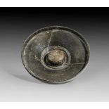 Etruscan omphalos bowl of the Black Glazed Ware with scrolling decor. 4th - 3rd century B.C.