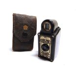 A CORONET MIDGET CAMERA with a black bakelite body, in original leather travel case.