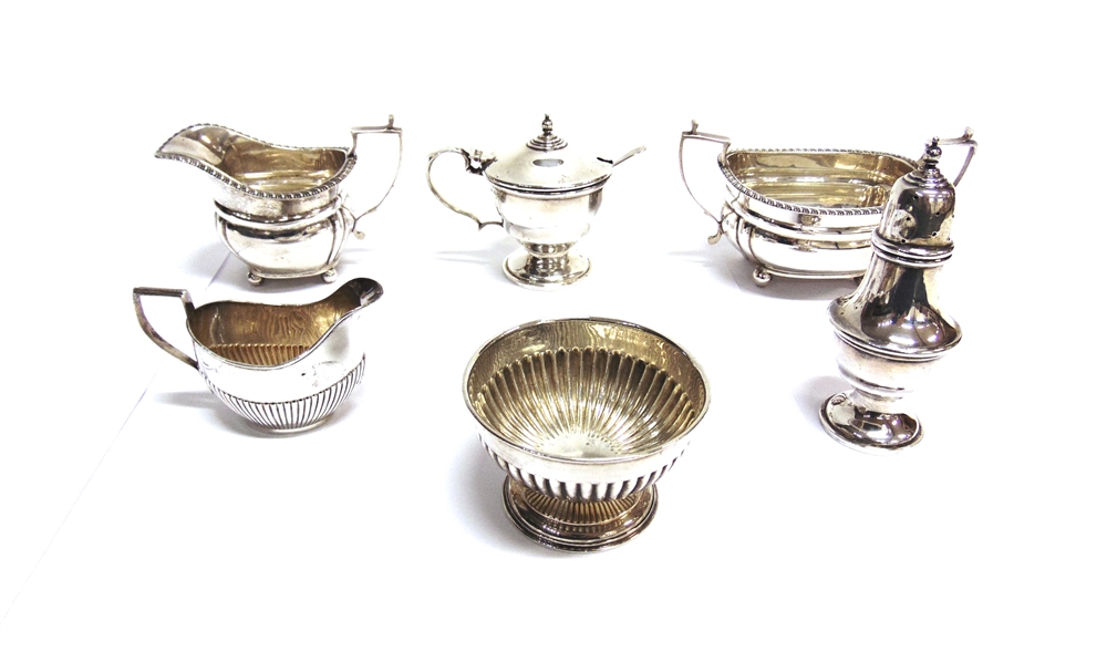 A SILVER GEORGIAN STYLE SUGAR BASIN with matching cream jug; a small silver bowl; a small silver