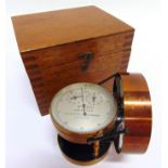 A NEGRETTI & ZAMBRA AIR METER (ANEMOMETER) the circular silvered dial with two subsidiary dials,