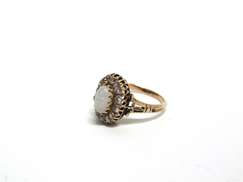 AN OPAL AND DIAMOND CLUSTER RING unmarked, the oval cabochon enclosed by fourteen old brilliant cuts - Image 3 of 4