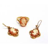 A 9 CARAT GOLD SHELL CAMEO RING finger size P 1/2; with a pair of 9 carat gold shell cameo drop