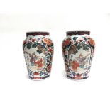 A PAIR OF BALUSTER SHAPED VASES the reserves painted in the Famille Verte palette with a pair of