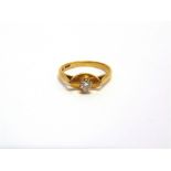 A SINGLE STONE DIAMOND RING stamped '18ct', finger size M 1/2, 3.5g gross