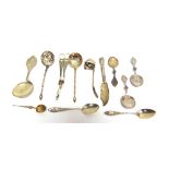 A COLLECTION OF ASSORTED FLATWARE comprising a silver anointing spoon; a silver cream ladle; two