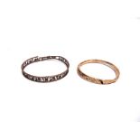 A PIERCED ARM RING stamped '9ct', 9.8g gross; and an unmarked hollow arm ring, 8.9g gross