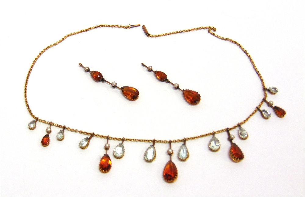 AN EDWARDIAN CITRINE, AQUAMARINE AND SEED PEARL SET FRINGE NECKLACE 42cm long; with a pair of