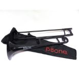 A JIGGS P-BONE BLACK PLASTIC TROMBONE in a travel bag.