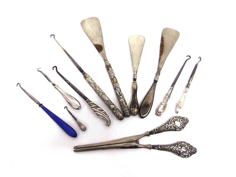 A COLLECTION OF SIX BUTTON HOOKS two shoe horns; a glove stretcher; and a button hook shoe horn set