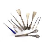 A COLLECTION OF SIX BUTTON HOOKS two shoe horns; a glove stretcher; and a button hook shoe horn set