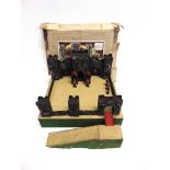 A TRI-ANG TOY FORT of painted wood and card construction, with five lead soldiers, boxed.