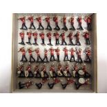 FORTY-THREE METAL MODEL BANDSMEN including pipes and drums, the bases unmarked, all unboxed.