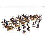 TWENTY-FIVE ARMIES IN PLASTIC MODEL SOLDIERS including the Camel Corps, all unboxed.