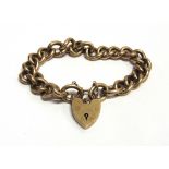 A MODERN 9CT GOLD CURB LINK BRACELET ON A PADLOCK CLASP Birmingham 1968, 55.8g gross.