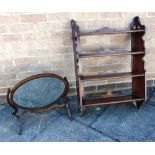 A SET OF FOUR TIER WALNUT HANGING SHELVES 62cm wide, and a dressing table mirror with oval glass