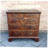 A WALNUT CHEST OF TWO SHORT AND THREE LONG DRAWERS on bracket feet, 96cm wide 53cm deep 92cm high