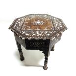 A MOORISH OCTAGONAL OCCASIONAL TABLE with bone inlaid marquetry decoration, 'secret' drawer to