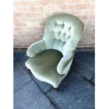 A BUTTON UPHOLSTERED NURSING CHAIR with serpentine front seat on carved cabriole supports