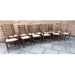 THIRTEEN MATCHING LADDERBACK CHAIRS including a pair of carvers