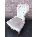 A BUTTON UPHOLSTERED NURSING CHAIR on turned supports