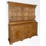 A LARGE OAK DRESSER the Delft rack with three drawers above five spice drawers, the base with four