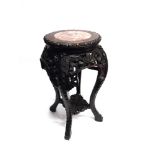 A CHINESE CARVED HARDWOOD PLANTSTAND with marble inset top, 60cm high