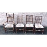 A SET OF FOUR LANCASHIRE ASH SPINDLE BACK DINING CHAIRS with rush seats, including a carver