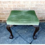 AN UPHOLSTERED STOOL ON CARVED MAHOGANY CABRIOLE SUPPORTS with claw and ball feet, 60cm x 50cm, 50cm