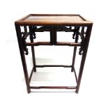 A CHINESE CARVED ROSEWOOD OCCASIONAL TABLE the oblong top 45cm x 30cm, 62cm high